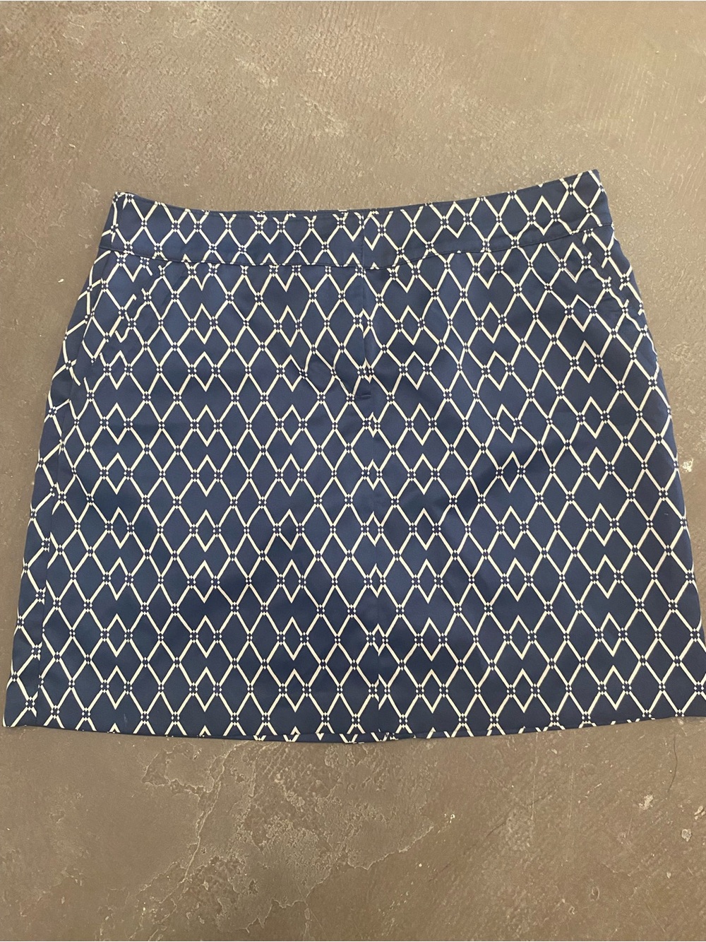 Izod Navy and White Geometric Mini Skirt with shorts on the bottom